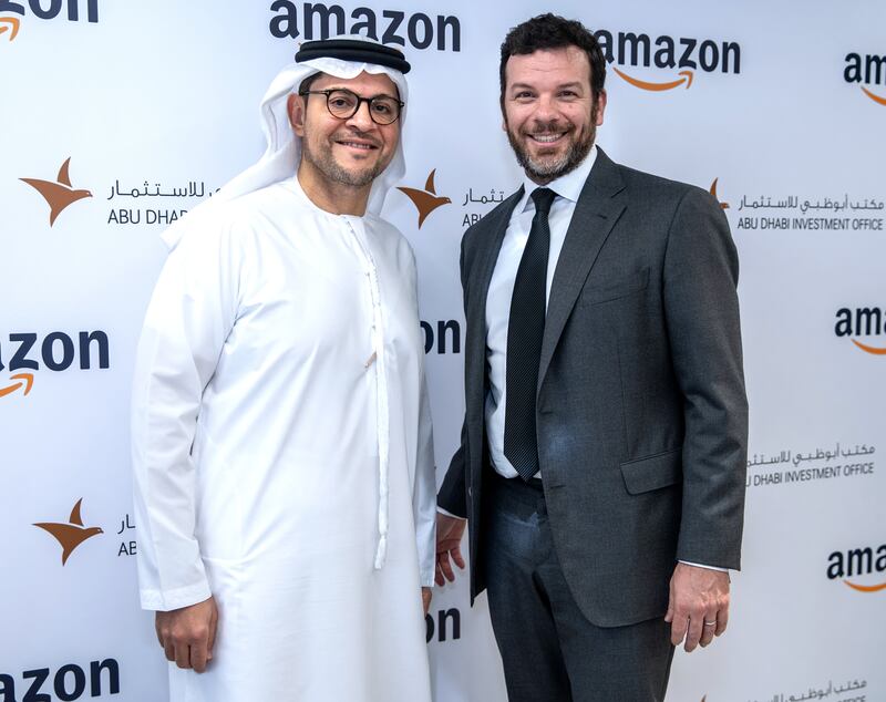 Mohammed Al Shorafa, chairman of the Abu Dhabi Department of Economic Development and head of Adio, left, and Russell Grandinetti of Amazon. Victor Besa / The National