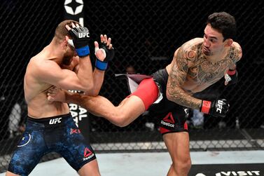 ABU DHABI, UNITED ARAB EMIRATES - JANUARY 17: (R-L) Max Holloway kicks Calvin Kattar in a featherweight bout during the UFC Fight Night event at Etihad Arena on UFC Fight Island on January 17, 2021 in Abu Dhabi, United Arab Emirates. (Photo by Jeff Bottari/Zuffa LLC)