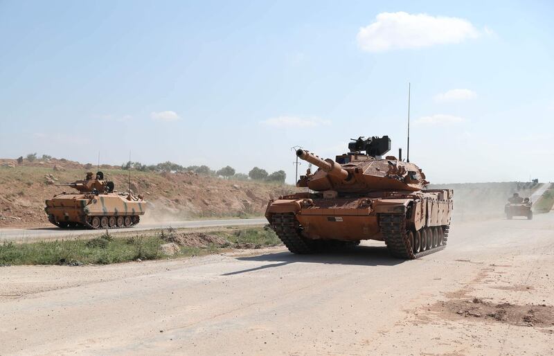 Turkish military tanks drive past the town of Ariha in Syria's rebel-held northwestern Idlib province. AFP