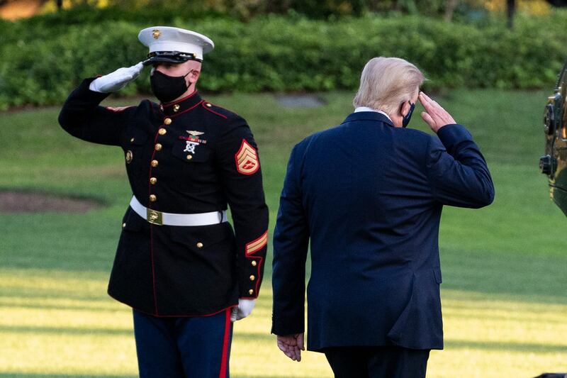 President Donald Trump salutes as he boards Marine One as he leaves the White House. AP Photo