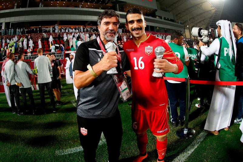 Bahrain defender Sayed Redha Isa and coach Helio Souza. AFP