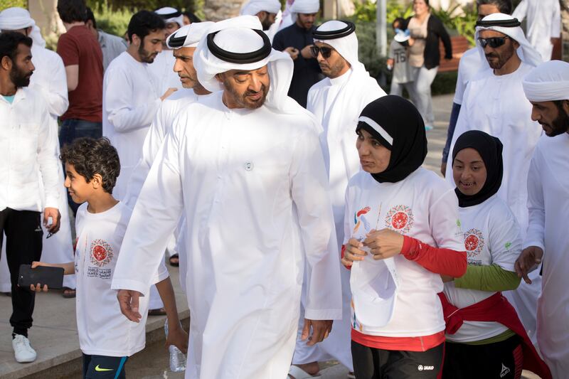ABU DHABI, UNITED ARAB EMIRATES - January 26, 2018: HH Sheikh Mohamed bin Zayed Al Nahyan, Crown Prince of Abu Dhabi and Deputy Supreme Commander of the UAE Armed Forces (2nd L), participates in the Special Olympics Wold Games Abu Dhabi 2019 initiative "Walk Unified", at Umm Al Emarat Park. Seen with HH Sheikh Nahyan Bin Zayed Al Nahyan, Chairman of the Board of Trustees of Zayed bin Sultan Al Nahyan Charitable and Humanitarian Foundation (back R).

( Hamad Al Mansouri for Crown Prince Court - Abu Dhabi )
—
