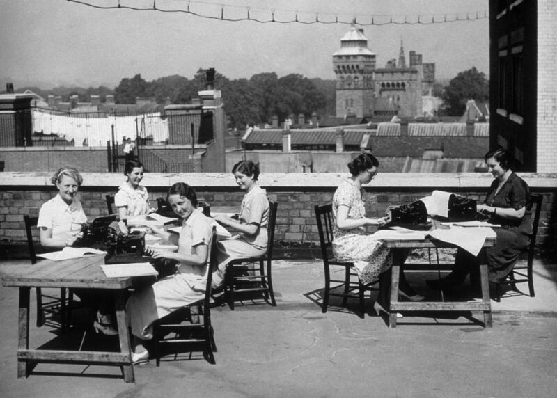 Typists cool off by working on a Cardiff roof-top in 1935.