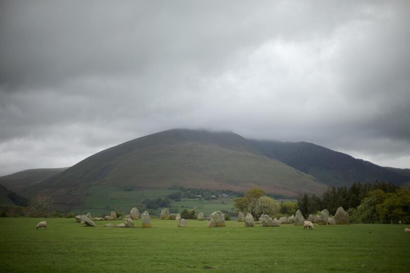 KESWICK, UNITED KINGDOM - MAY 09:  Blencathra Mountain, which is up for sale, overlooks  the Neolithic stone circle of Castlerigg on May 9, 2014 in Keswick, United Kingdom. The Earl of Lonsdale, Hugh Lowther, has put Blencathra up for sale for 1.75M GBP to try and pay off an inheritance tax bill. Local community groups are now using social media to campaign and raise money to buy the 2,850ft (869m) mountain and keep it in Biritish ownership.  (Photo by Christopher Furlong/Getty Images)