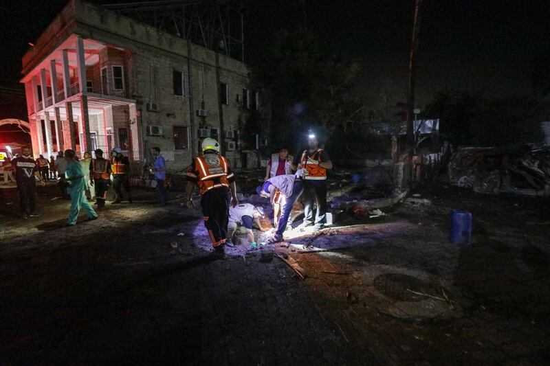 Emergency services search the rubble at Al Ahli Hospital after an air strike in Gaza city. EPA