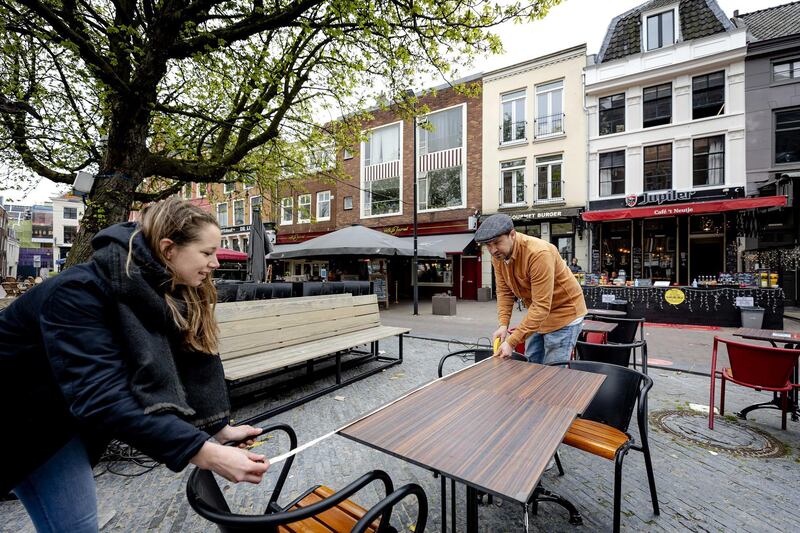 Employees make the terrace of a cafe coronavirus proof in Utrecht, The Netherlands. EPA