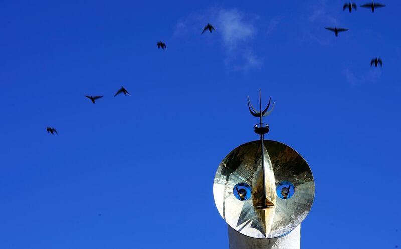 In this image birds fly past the Tower of the Sun at the Expo '70 Commemorative Park north of Osaka, Japan. AP