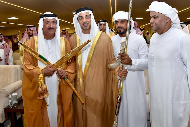 TAIF, SAUDI ARABIA - September 15, 2019: HH Sheikh Mansour bin Zayed Al Nahyan, UAE Deputy Prime Minister and Minister of Presidential Affairs (2nd L), presents an award to the winners of the Saudi Crown Prince Camel Festival, at Taif. Seen with HH Sheikh Sultan bin Hamdan bin Mohamed Al Nahyan (L).

( Hassan Al Menhali for the Ministry of Presidential Affairs  )
---