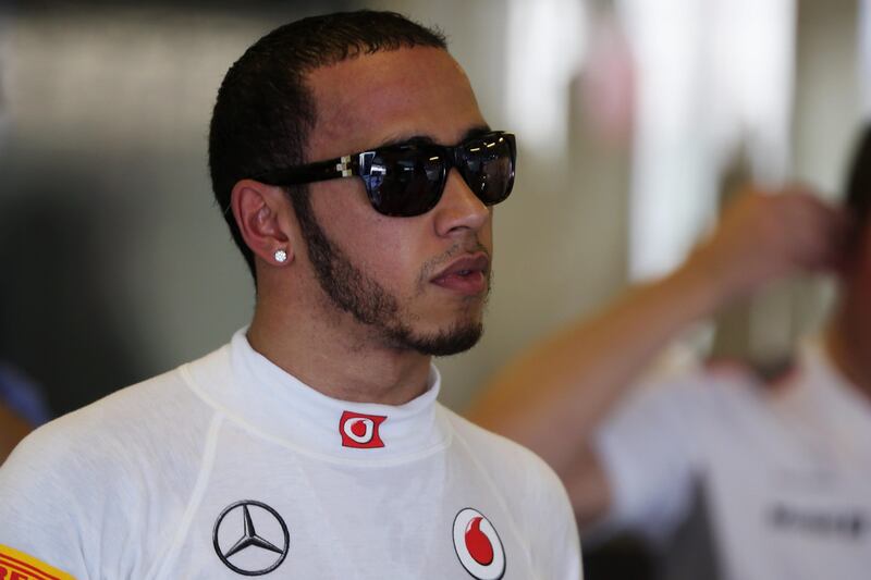 ABU DHABI, UNITED ARAB EMIRATES - NOVEMBER 03:  Lewis Hamilton of Great Britain and McLaren prepares to drive during the final practice session prior to qualifying for the Abu Dhabi Formula One Grand Prix at the Yas Marina Circuit on November 3, 2012 in Abu Dhabi, United Arab Emirates.  (Photo by Mark Thompson/Getty Images) *** Local Caption ***  155340120.jpg