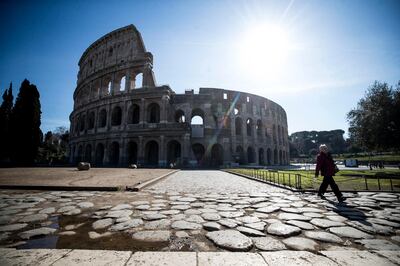 epa08283323 An elderly woman walks near the deserted Colosseum in Rome, Italy, 10 March 2020.   In an attempt to stop the spreading of the novel coronavirus Covid-19, Italian Prime Minister Conte extended the coronavirus quarantine to the entire country starting on 10 March till 03 April. It will be possible to move only for 'proven work reasons' or 'serious family or health needs', he said. All public gatherings have been banned and people have been advised to stay at home  EPA/ANGELO CARCONI