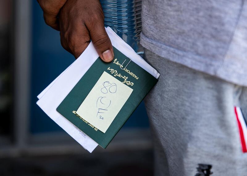 DUBAI, UNITED ARAB EMIRATES. 18 June 2020. 
Pakistani citizens who live in Dubai line up outside Dnata. They’ve received a confirmation call from the consulate regarding their repatriation flights. Some are flying back tonight.
(Photo: Reem Mohammed/The National)

Reporter:
Section: