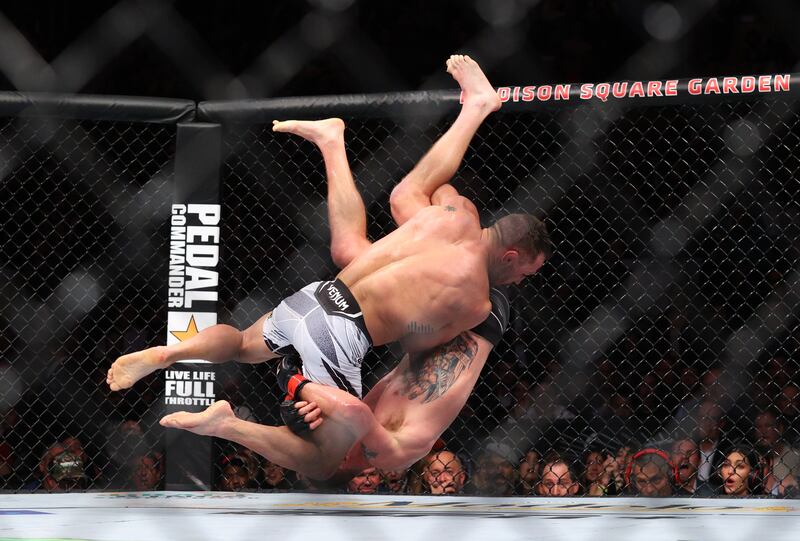 Justin Gaethje throws Michael Chandler. Reuters