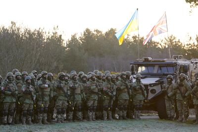 Ukrainian troops and their UK military instructors commemorate lives lost in the Russian invasion. PA 