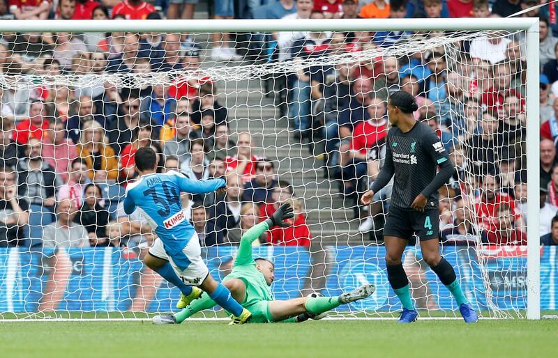 Napoli's Amin Younes scores their third goal. Reuters