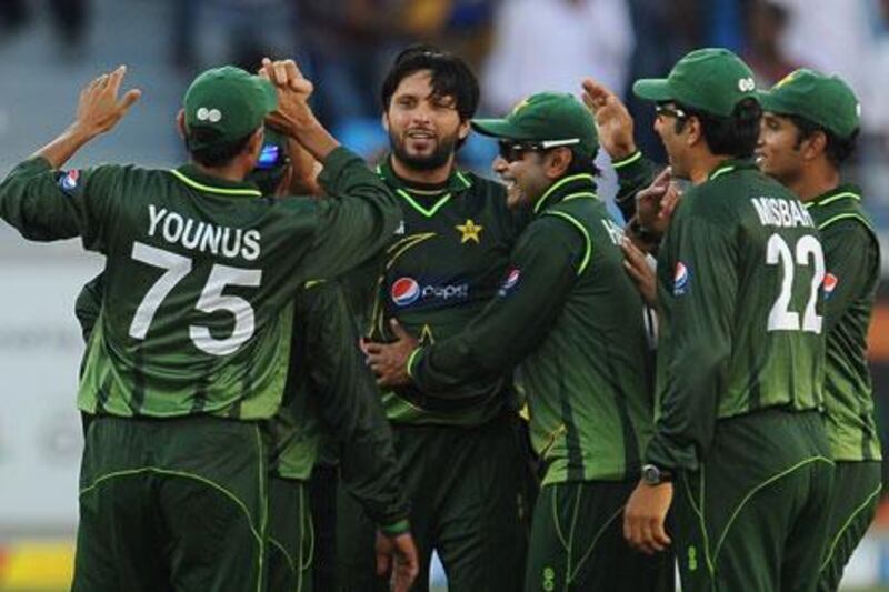 Shahid Afridi, centre, came out of retirement to take three wickets against Sri Lanka.