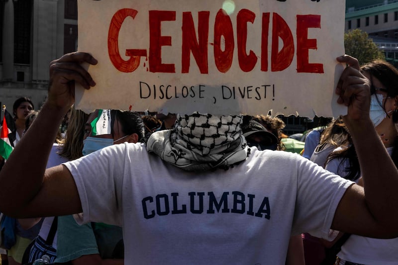 A demonstrator protests outside the encampment established in support of Palestinians in Gaza at Columbia University, in New York City. AFP