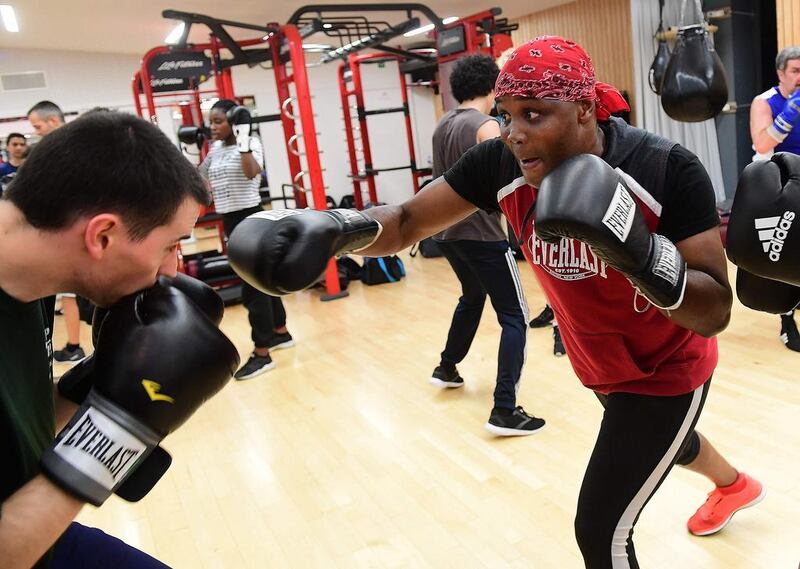 Belgium lawmaker and former international middleweight boxing champion Bea Diallo, right, leads a boxing training class in Brussels on October 26, 2016. He was one of the best middleweight boxers of his time and says he understands what turns youngsters to the dark side but is hoping to motivate young Belgians and steer some away from Islamic extremism. Emmanuel Dunand / AFP 