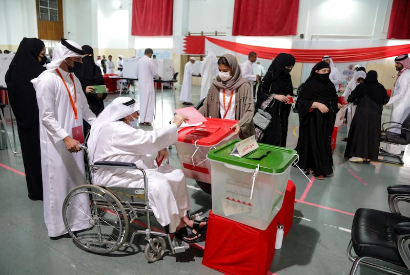 Bahraini voters at a polling station on the island of Muharraq. A decision to double the rate of VAT is a contentious one at this election.