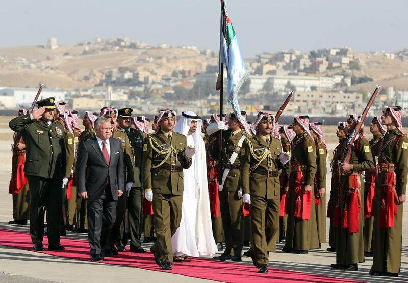 Sheikh Mohamed bin Zayed and King Abdullah II review an honour guard, at Queen Alia Airport in the Jordanian capital of Amman. Khalil Mazraawi / AFP