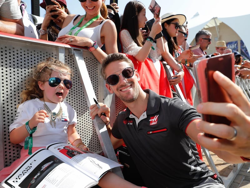 Romain Grosjean greets his fans during an exclusive autograph signing session at Yas Marina Circuit. Courtesy Yas Marina Circuit