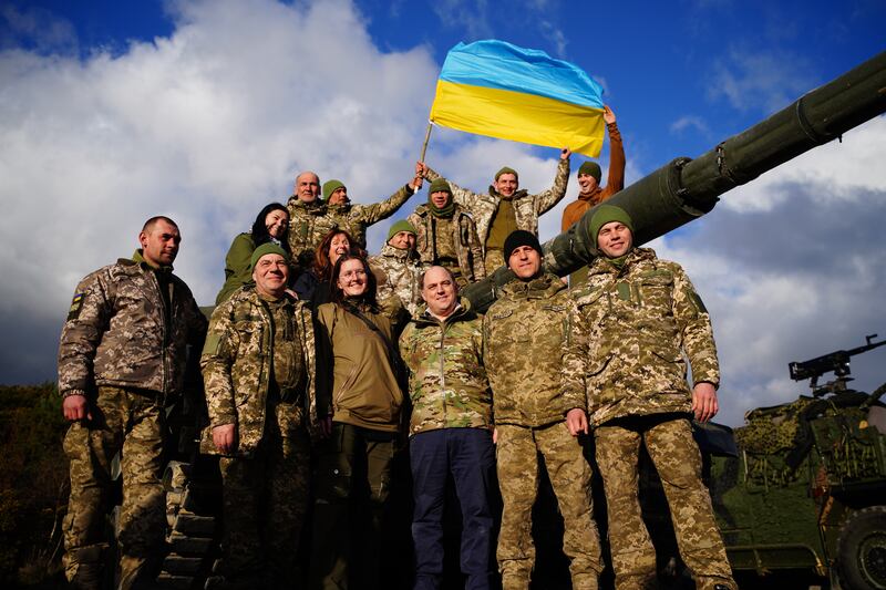 Ben Wallace with Ukrainian soldiers during a visit to Bovington Camp, a British Army military base in Dorset. PA
