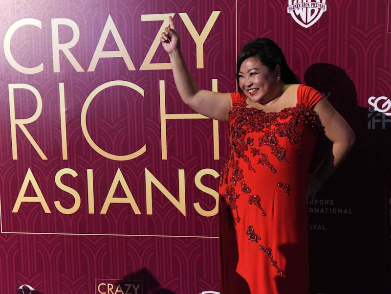 Singaporean performer Selena Tan posing at the premiere of the film 'Crazy Rich Asians' at the Capitol Theatre in Singapore. Roslan Rahman / AFP