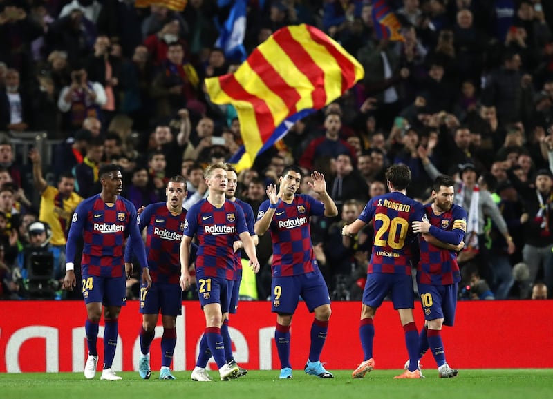 Luis Suarez, centre, celebrates with Barcelona teammates. Getty
