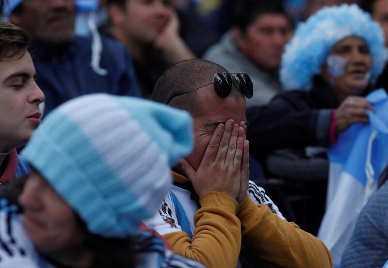 Argentina's fans react as they watch a broadcast of the World Cup Group D Argentina vs Nigeria match, at a public viewing area at a square in Buenos Aires, Argentina. Martin Acosta / Reuters