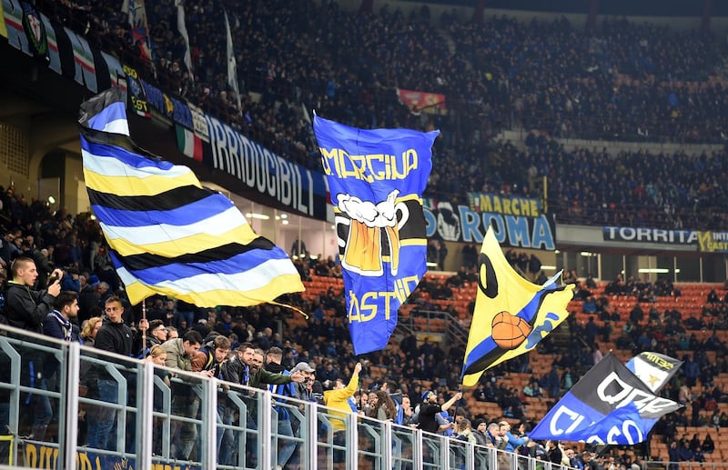 Soccer Football - Serie A - Inter Milan v Hellas Verona - San Siro, Milan, Italy - November 9, 2019 Hellas Verona fans wave flags inside the stadium REUTERS/Daniele Mascolo