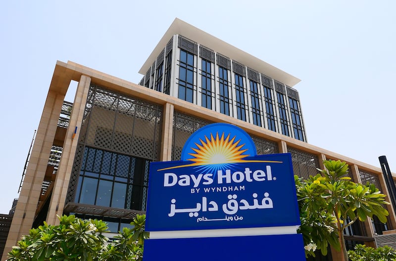 A hotel sign outside the One Deira Plaza.