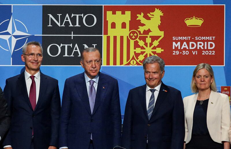 Nato Secretary General Jens Stoltenberg, Turkish President Tayyip Erdogan, Finland's President Sauli Niinisto and Sweden's Prime Minister Magdalena Andersson after signing a document at the Nato summit in Madrid last June. Reuters