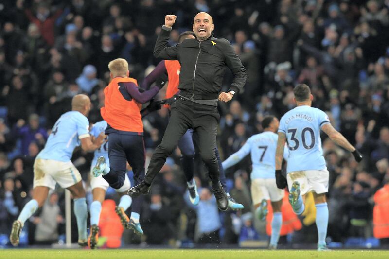 Manchester City's Spanish manager Pep Guardiola celebrates after Manchester City's English midfielder Raheem Sterling scores his team's second goal during the English Premier League football match between Manchester City and Southampton at the Etihad Stadium in Manchester, north west England, on November 29, 2017. - Manchester City won the match 2-1. (Photo by Lindsey PARNABY / AFP) / RESTRICTED TO EDITORIAL USE. No use with unauthorized audio, video, data, fixture lists, club/league logos or 'live' services. Online in-match use limited to 75 images, no video emulation. No use in betting, games or single club/league/player publications. / 