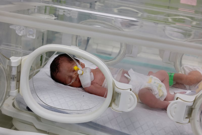 An infant saved from the womb of her mother Sabreen Al Sheikh, who was killed in an Israeli strike along with her husband Shokri and her daughter Malak, lies in an incubator at Al Emirati hospital in Rafah, on April 21. Reuters