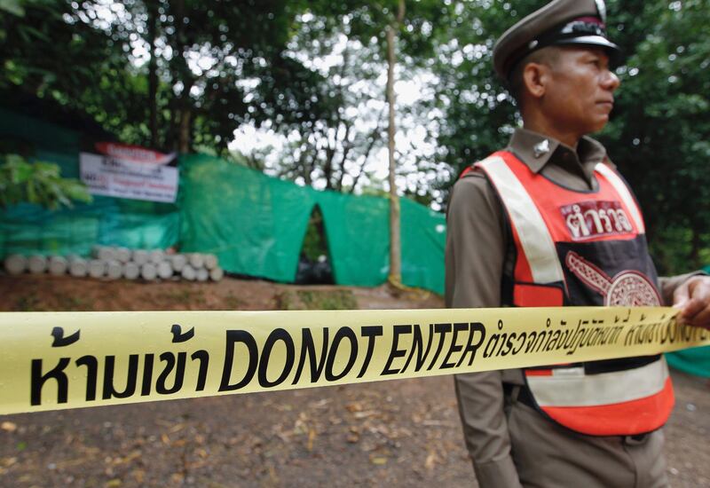 A Thai police officer stands guard at the blocking area. EPA