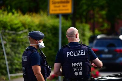 VERL, GERMANY - JUNE 20: Local police forces secure an apartment complex used by the Toennies meat company to house foreign workers from eastern Europe during the coronavirus pandemic on June 20, 2020 in Verl, near Guetersloh, Germany. Authorities are considering a lockdown of the entire region following the confirmation of at least 800 Covid-19 infections among workers at the Toennies plant. A total of 7,000 people work at the facility and many of them have not yet been tested. Schools and child day care centers in the region have already been closed. (Photo by Alexander Koerner/Getty Images)