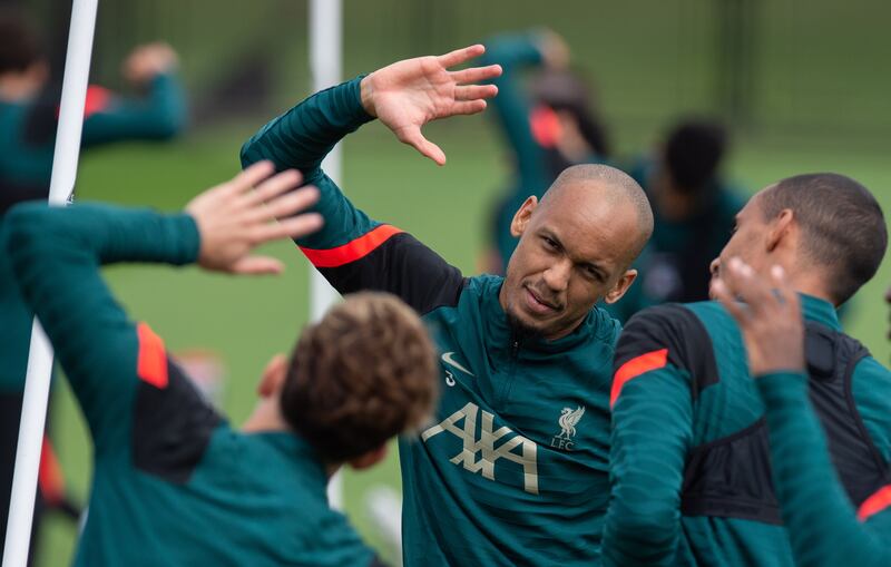 Liverpool midfielder Fabinho warms up at training. EPA