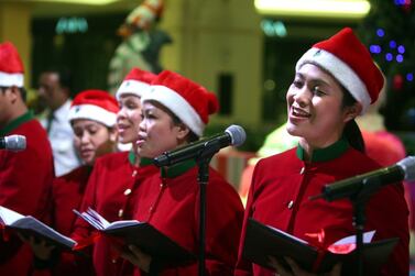 UAE residents sing Christmas songs in Mall of the Emirates. Sammy Dallal / The National