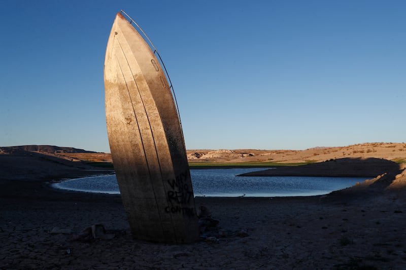 A formerly sunken boat sits upright on the shore of Lake Mead, Nevada, where water levels have dropped. EPA