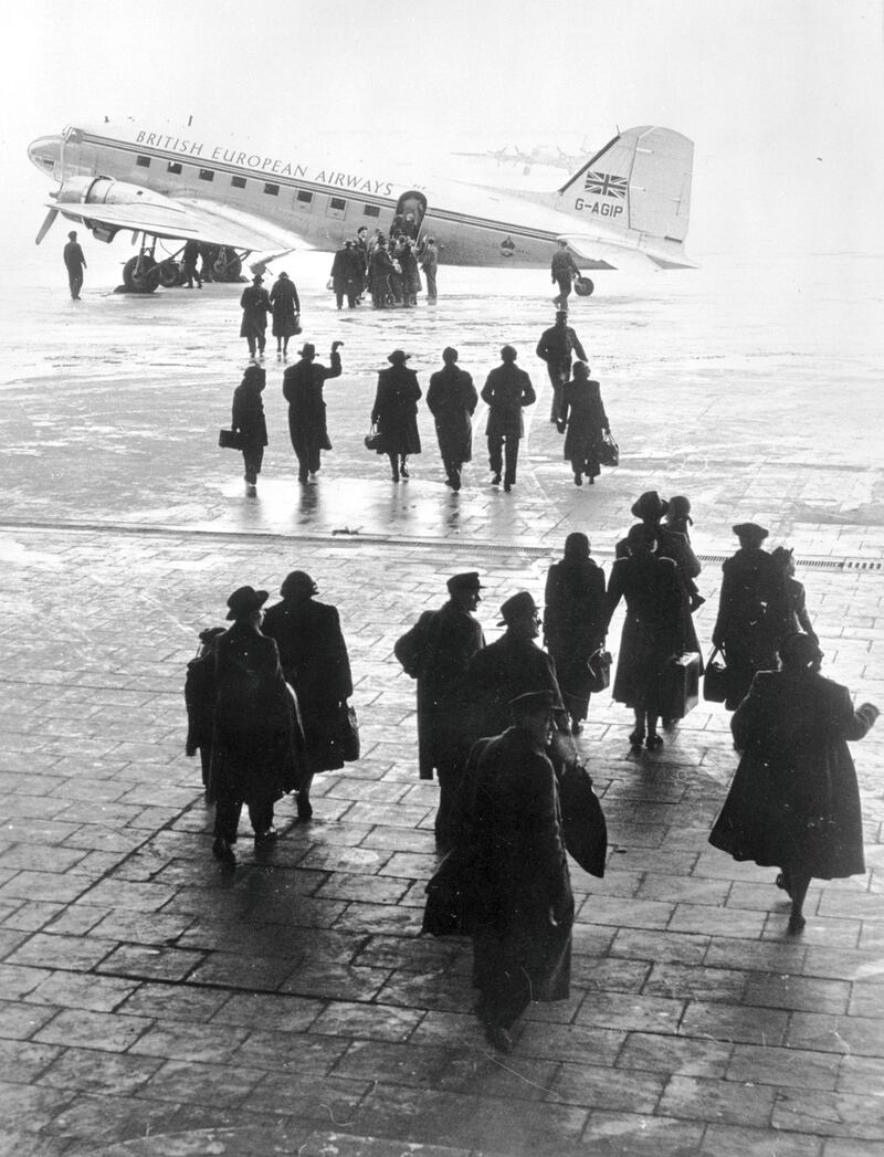 circa 1955:  Passengers crossing the runway at Berlin's Tempelhof Airport to board a British European Airways flight.  (Photo by Three Lions/Getty Images)