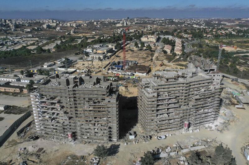 A picture taken on October 13, 2020, shows new apartments buildings under construction in the Beit El settlement in the occupied the West Bank. / AFP / MENAHEM KAHANA
