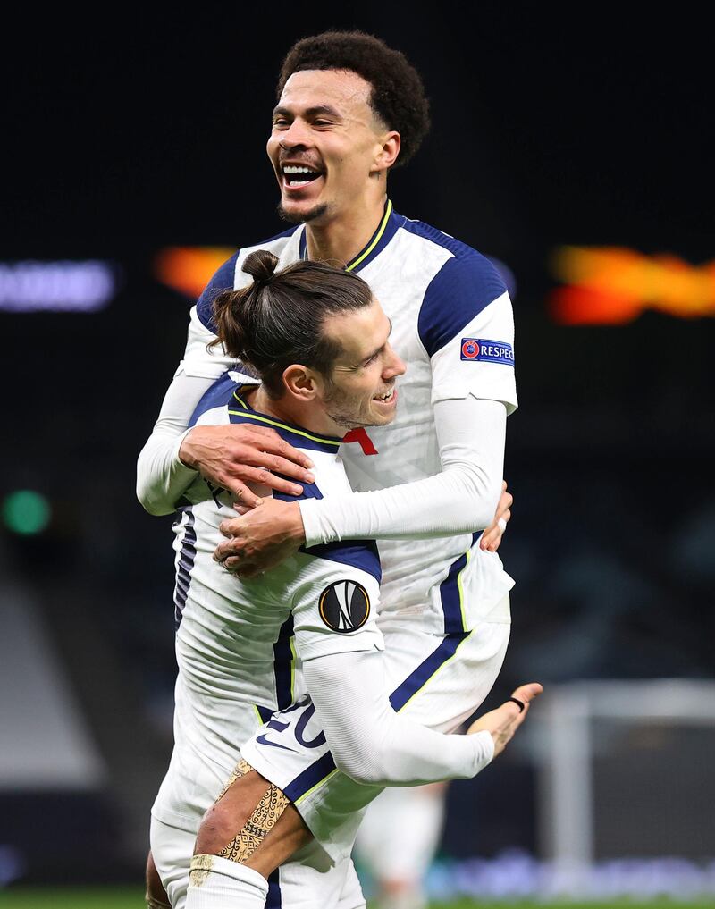 Tottenham's Gareth Bale, left, and Tottenham's Dele Alli celebrate scoring their side's third goal during the Europa League round of 32 second leg soccer match between Tottenham Hotspur and Wolfsberger AC at the Tottenham Hotspur Stadium in London, England, Wednesday, Feb. 24, 2021. (Julian Finney/Pool via AP)