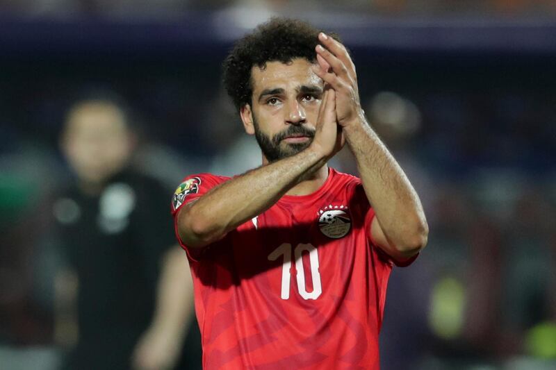 Egypt's Mohamed Salah applauds fans at the end of the African Cup of Nations round of 16 soccer match between Egypt and South Africa in Cairo International stadium in Cairo, Egypt, Saturday, July 6, 2019. South Africa won 1-0. (AP Photo/Hassan Ammar)