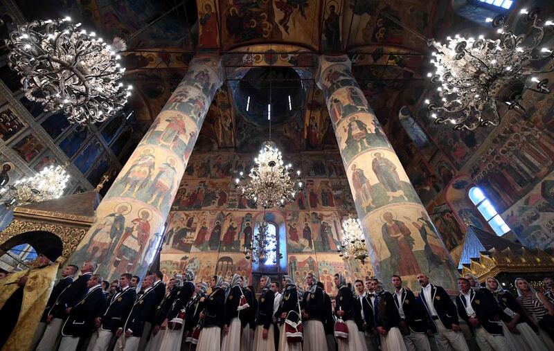 Members of Russia’s Olympic team wait to receive blessings from the Russian Orthodox Patriarch Kirill during a religious service at a cathedral in the Kremlin in Moscow. Kirill Kudryavtsev / AFP Photo