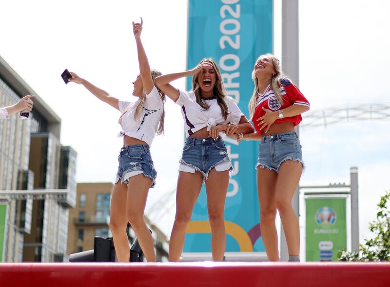 England fans on top of a bus outside Wembley stadium ahead of the Euro 2020 final against Italy.