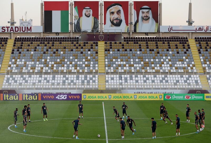 Under the images of UAE leaders, Brazil's players train during a practice session in Abu Dhabi, United Arab Emirates, Tuesday, Nov. 12, 2019. Brazil will play a friendly match against South Korea on Nov. 19th. (AP Photo/Kamran Jebreili)