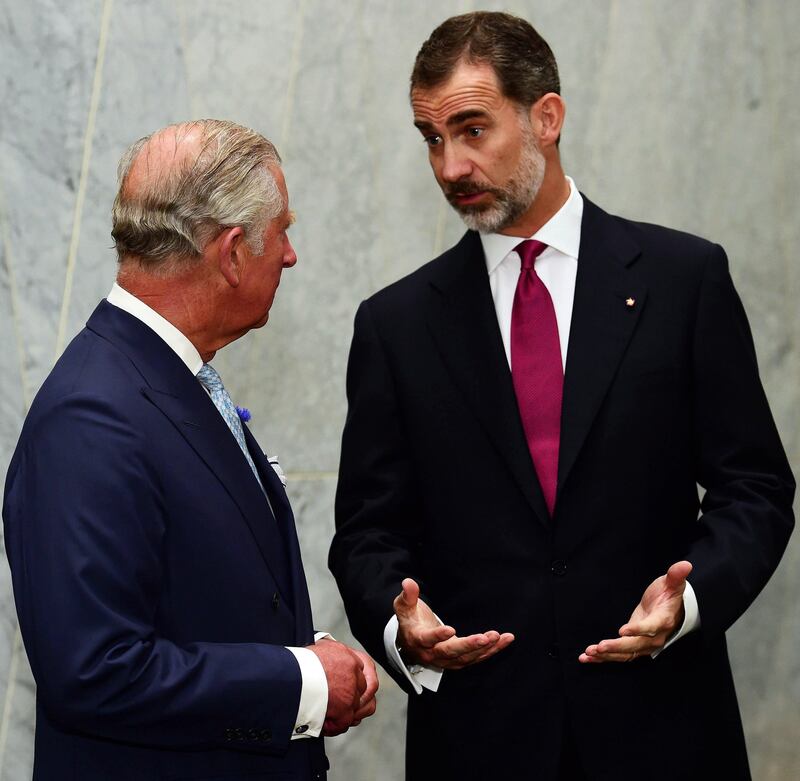 Britain's Prince Charles (L) chats with King Felipe VI (R) at a hotel in central London.