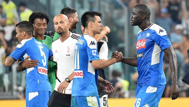 Napoli players shake hands after losing to Juventus. EPA