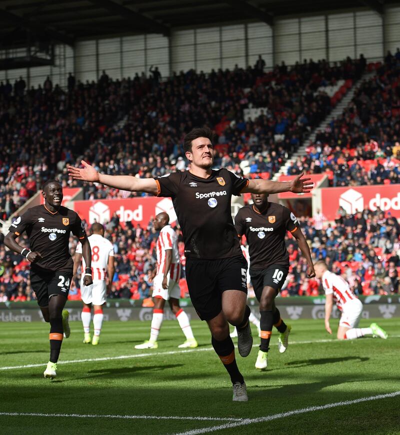 Hull City's English defender Harry Maguire celebrates scoring Hull's first goal during the English Premier League football match between Stoke City and Hull City at the Bet365 Stadium in Stoke-on-Trent, central England on April 15, 2017. / AFP PHOTO / Oli SCARFF / RESTRICTED TO EDITORIAL USE. No use with unauthorized audio, video, data, fixture lists, club/league logos or 'live' services. Online in-match use limited to 75 images, no video emulation. No use in betting, games or single club/league/player publications.  / 