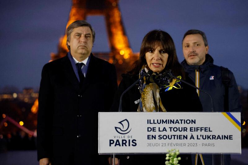 Paris Mayor Anne Hidalgo speaks alongside the Ukrainian ambassador to France, Vadym Omelchenko, during an event to light Eiffel Tower in the colours of the Ukrainian flag on Thursday. AFP