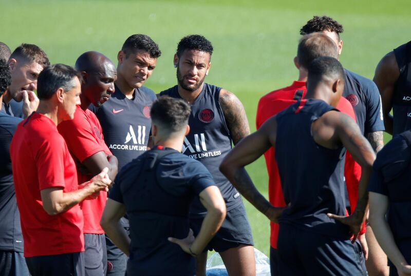 Neymar with Thiago Silva, coach Thomas Tuchel and teammates during training. Reuters